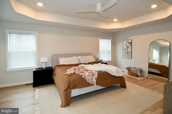 a bedroom with a bed lamp and window