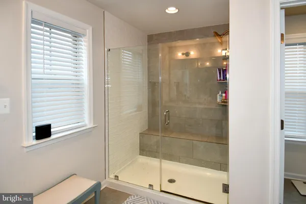 a bathroom with a shower and toilet