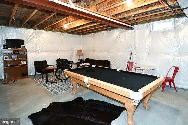 a room with furniture and a flat screen tv