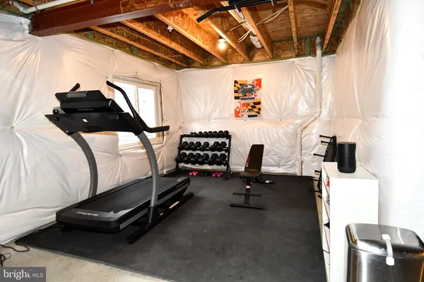 a room with gym equipment and equipment