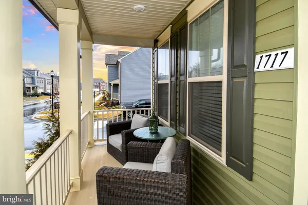 a balcony view with outdoor seating