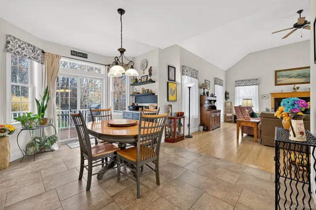 a dining room filled with furniture and window