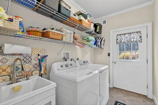 a utility room with dryer and washer