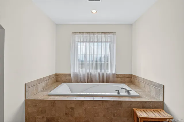 a view of bath tub sitting in a room