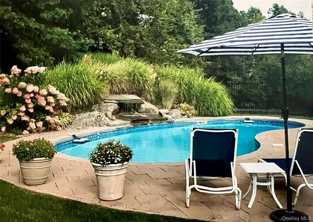 a view of a chair and table of the garden