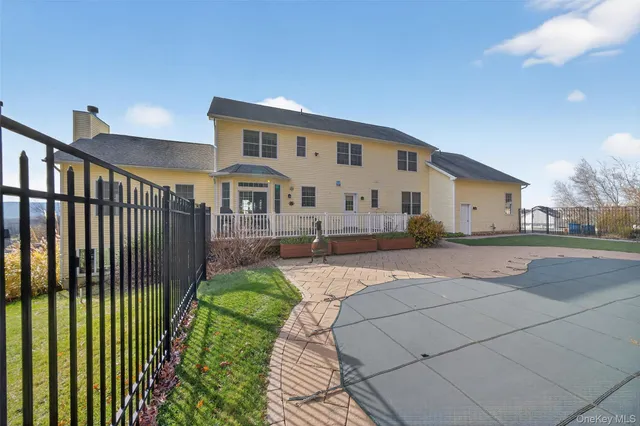 a front view of a house with a garden and plants