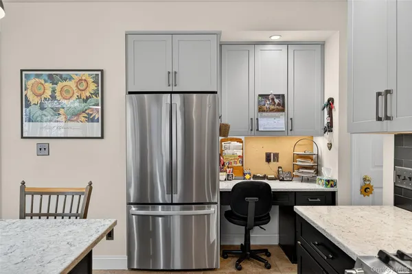 a spacious bathroom with a granite countertop sink and a mirror