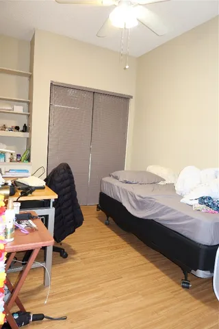 a bedroom with a bed and a table