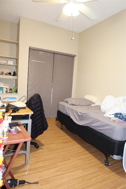 612 Park Place, Unit 202 Austin, TX 78705 - Photo 17 of 25 a bedroom with a bed and a table