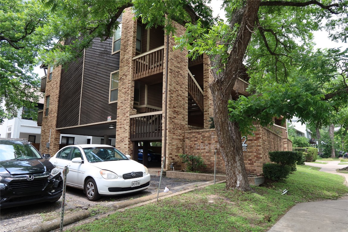 612 Park Place, Unit 202 Austin, TX 78705 - Photo 2 of 25 a front view of a house with a garden