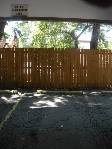 a brick building with a street sign