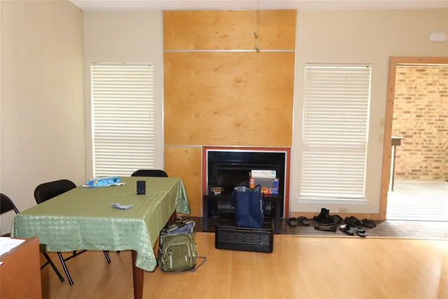 a front view of a house with a table and chairs