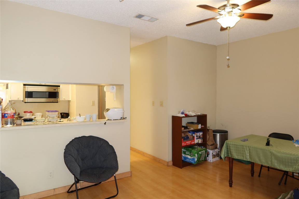 612 Park Place, Unit 202 Austin, TX 78705 - Photo 5 of 25 a room with furniture and a flat screen tv