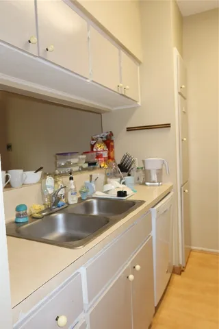 a kitchen with a sink and a refrigerator