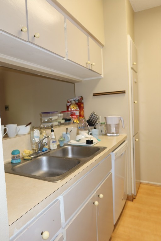 612 Park Place, Unit 202 Austin, TX 78705 - Photo 9 of 25 a kitchen with a sink and a refrigerator