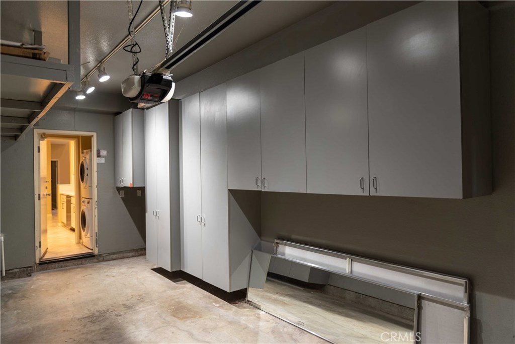 8215 East White Oak Ridge, Unit 108 Orange, CA 92869 - Photo 13 of 15 One car garage with direct access into unit, storage cabinets and garage door opener- Plus to get an assigned parking space that is close to unit