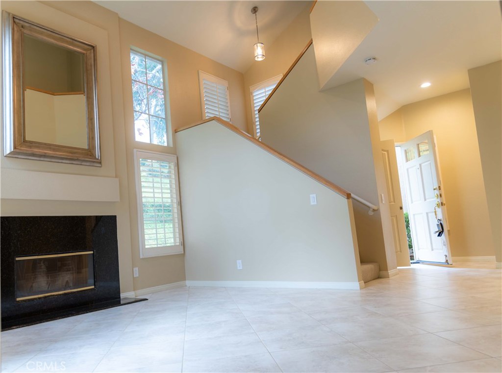 8215 East White Oak Ridge, Unit 108 Orange, CA 92869 - Photo 6 of 15 View from slider to front door and stairs to upper level- Note recessed lighting
