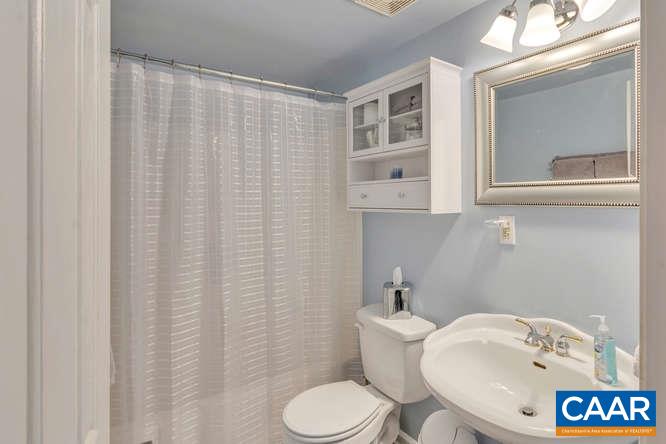 13 East Point Road Palmyra, VA 22963 - Photo 25 of 47 a white toilet sitting next to a bathroom sink