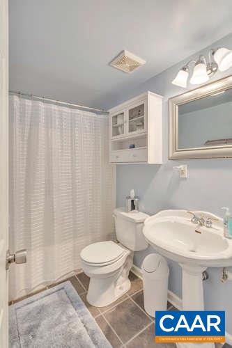 13 East Point Road Palmyra, VA 22963 - Photo 26 of 47 a bathroom with a sink a toilet and a mirror