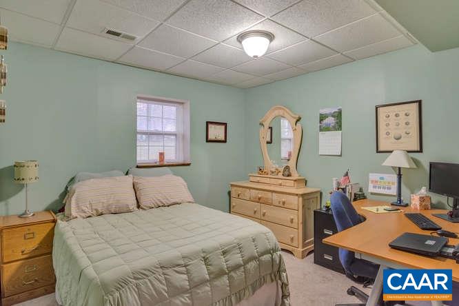 13 East Point Road Palmyra, VA 22963 - Photo 27 of 47 a bedroom with a bed and wooden floor
