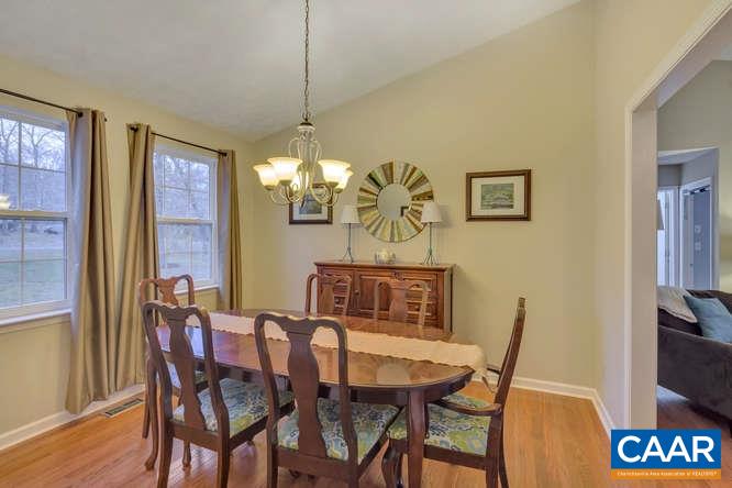 13 East Point Road Palmyra, VA 22963 - Photo 10 of 47 a view of a dining room with furniture wooden floor and chandelier