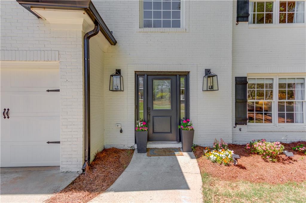 2310 Olde Hickory Place Monroe, GA 30656 - Photo 3 of 46 a view of front door of house with potted plant