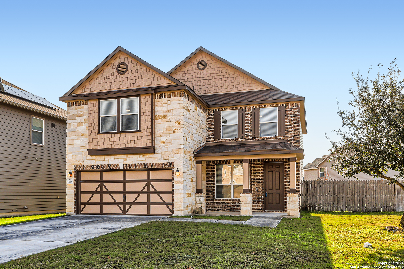 6418 Wind Canyon San Antonio, TX 78239 - Photo 1 of 1 a front view of a house with a yard
