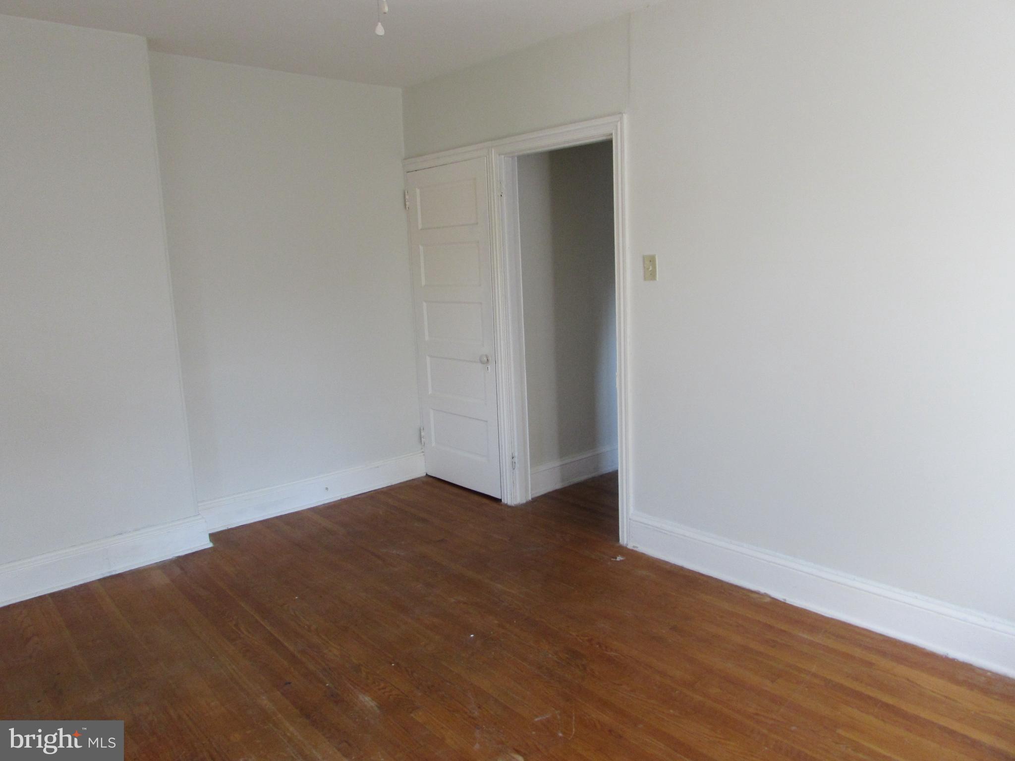 5903 Greene Street, Unit 3 Philadelphia, PA 19144 - Photo 12 of 19 a view of an empty room with wooden floor