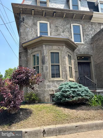 a view of a house with a garden