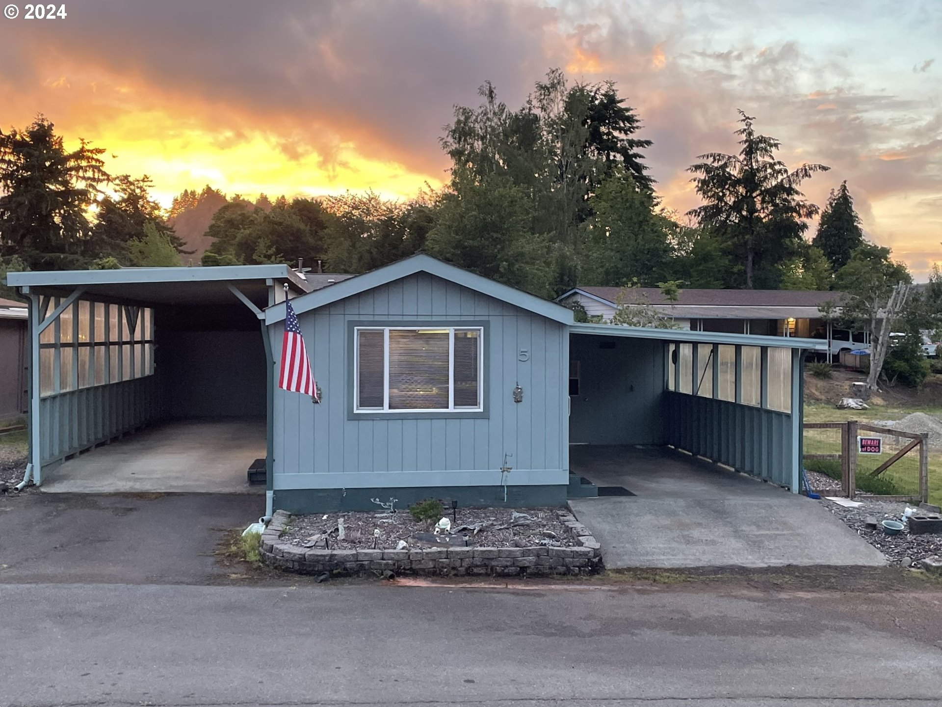 100 River Bend Road, Unit 5 Reedsport, OR 97467 - Photo 1 of 18 a front view of house with yard
