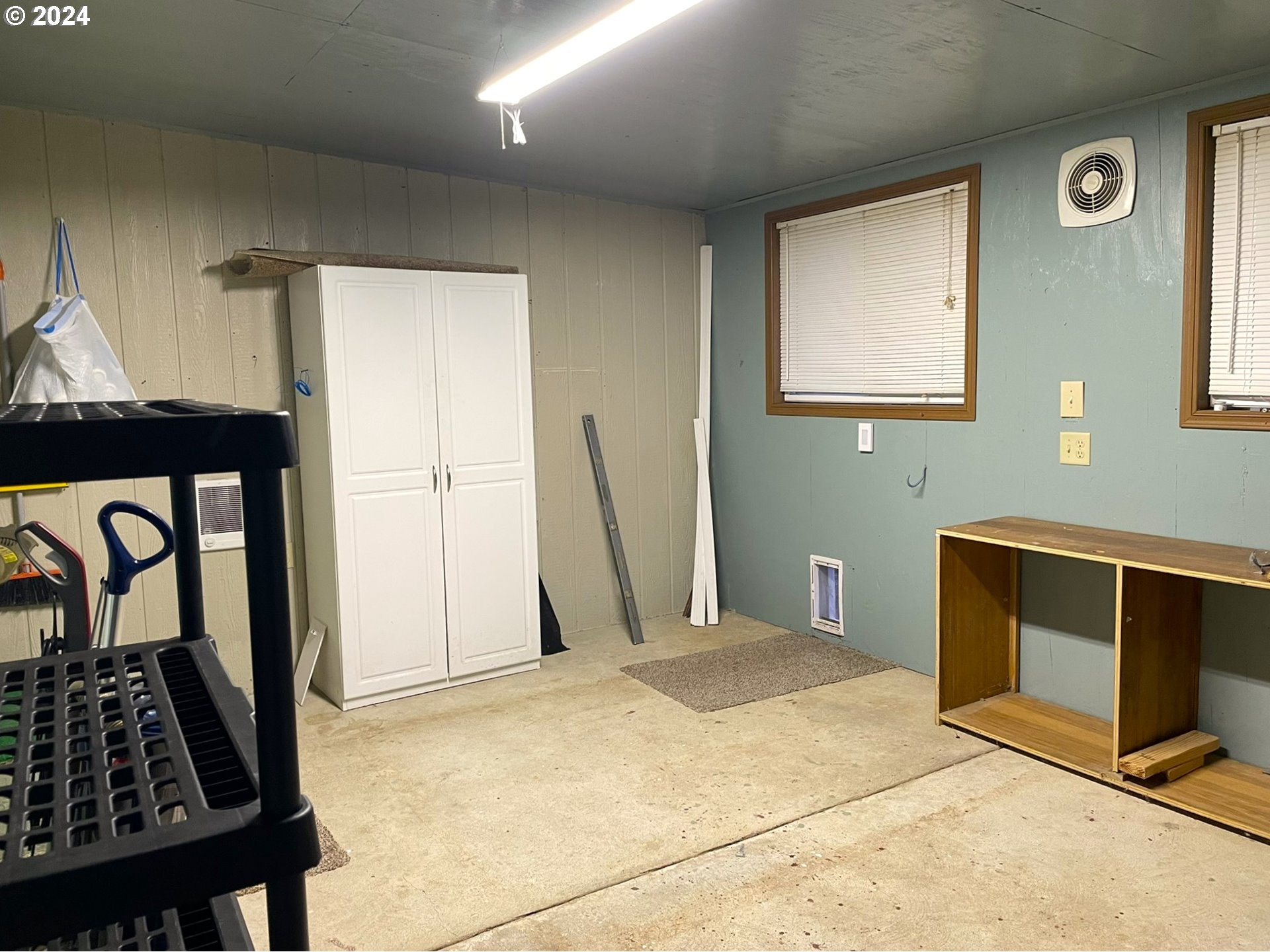 100 River Bend Road, Unit 5 Reedsport, OR 97467 - Photo 15 of 18 a bedroom with a bed and a window
