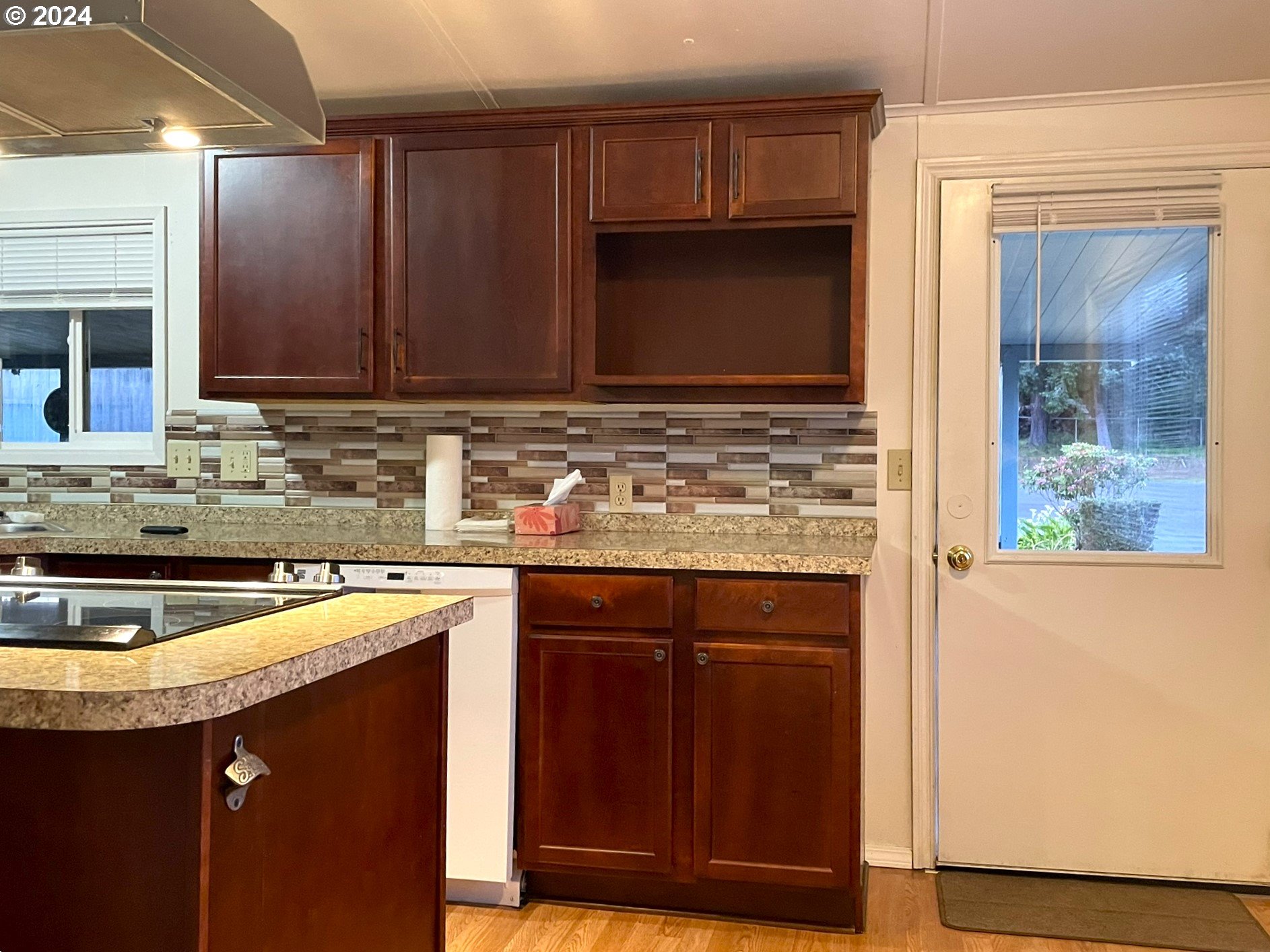 100 River Bend Road, Unit 5 Reedsport, OR 97467 - Photo 3 of 18 a kitchen with stainless steel appliances granite countertop a sink stove and cabinets