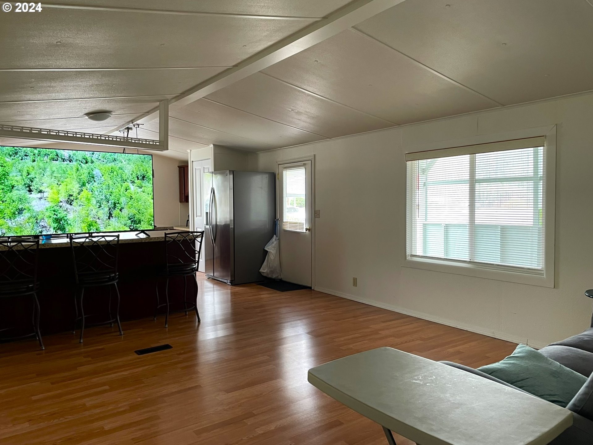 100 River Bend Road, Unit 5 Reedsport, OR 97467 - Photo 6 of 18 a living room with furniture window and wooden floor