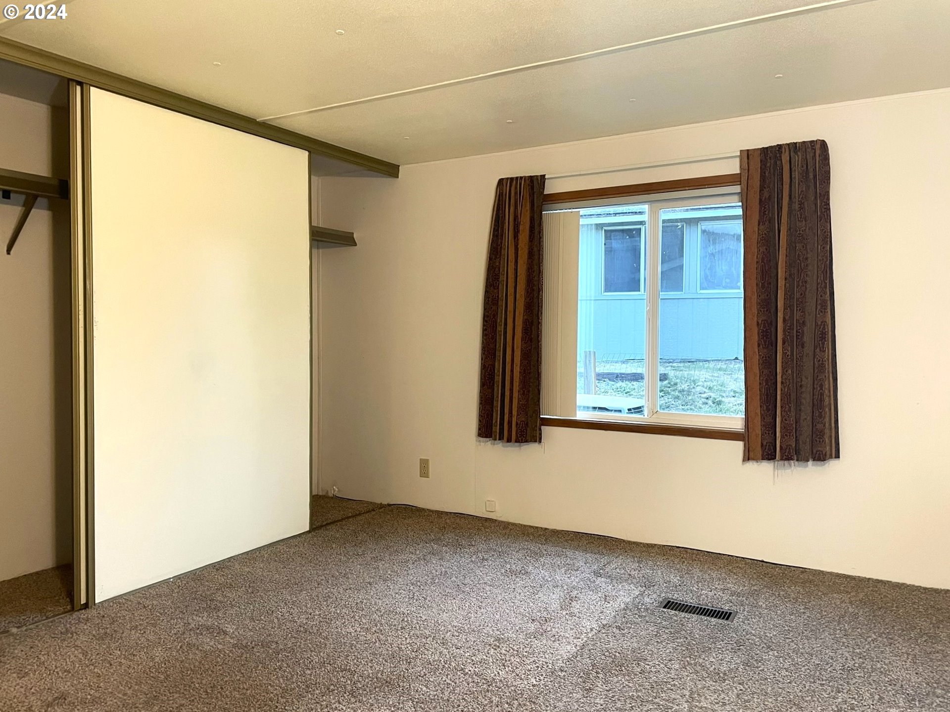 100 River Bend Road, Unit 5 Reedsport, OR 97467 - Photo 7 of 18 a view of a room that has a window in it