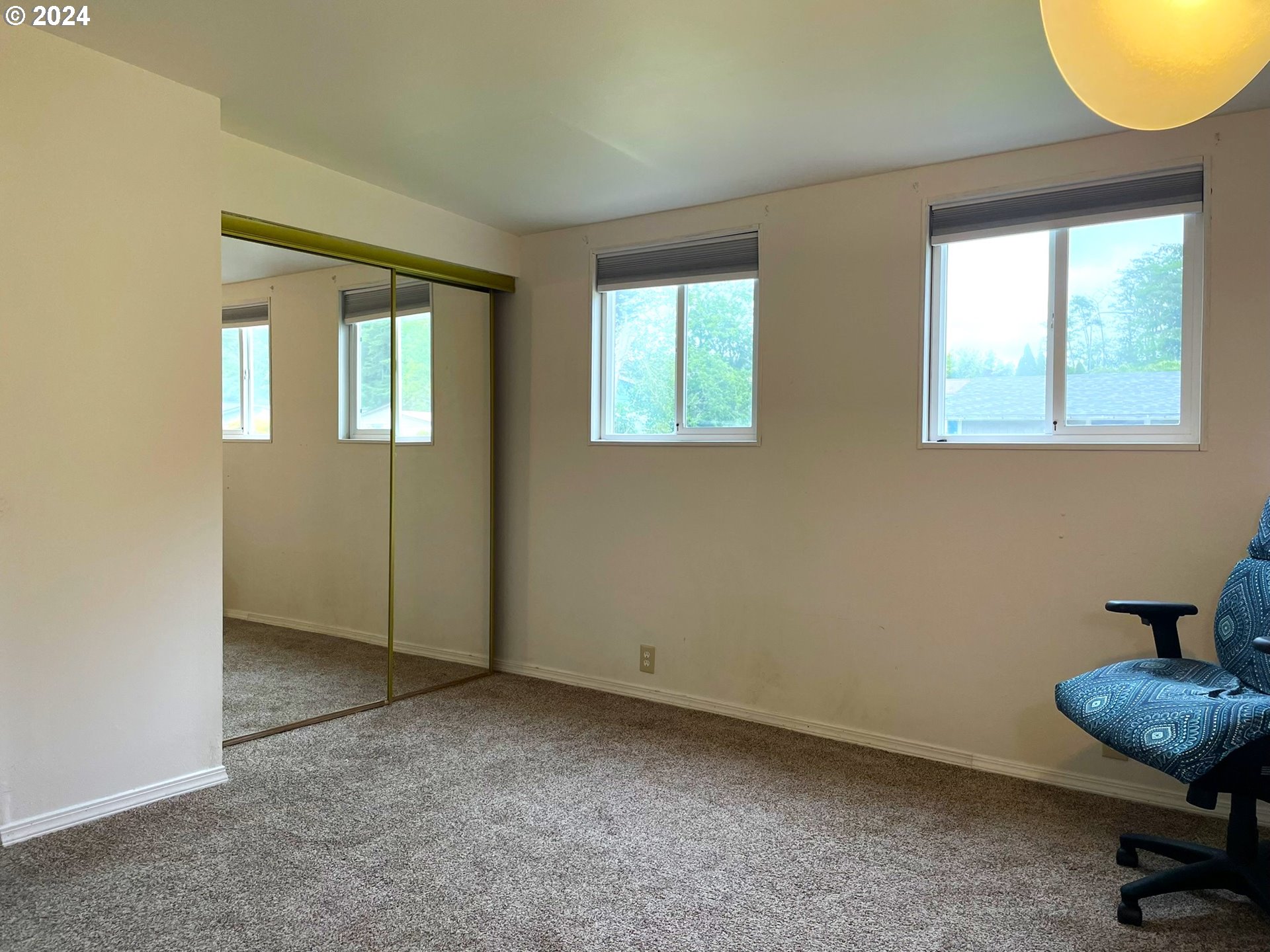100 River Bend Road, Unit 5 Reedsport, OR 97467 - Photo 10 of 18 a view of an empty room and window