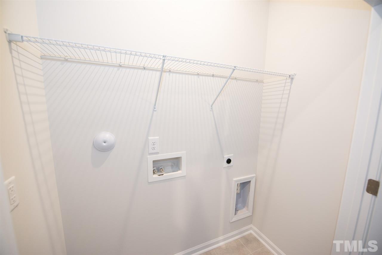 3610 Water Mist Lane, Unit 30 Raleigh, NC 27604 - Photo 18 of 25 a bathroom with a shower and a window