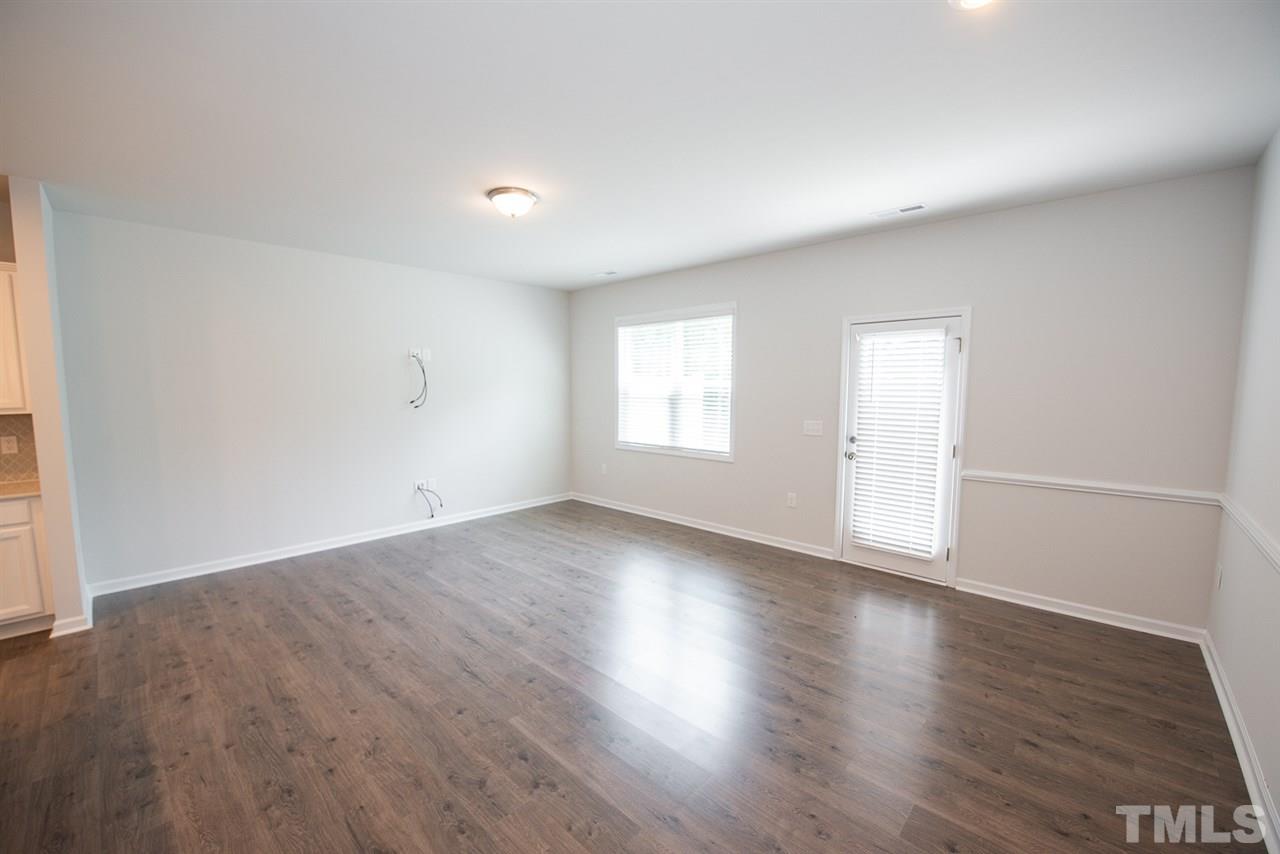3610 Water Mist Lane, Unit 30 Raleigh, NC 27604 - Photo 4 of 25 an empty room with wooden floor and window