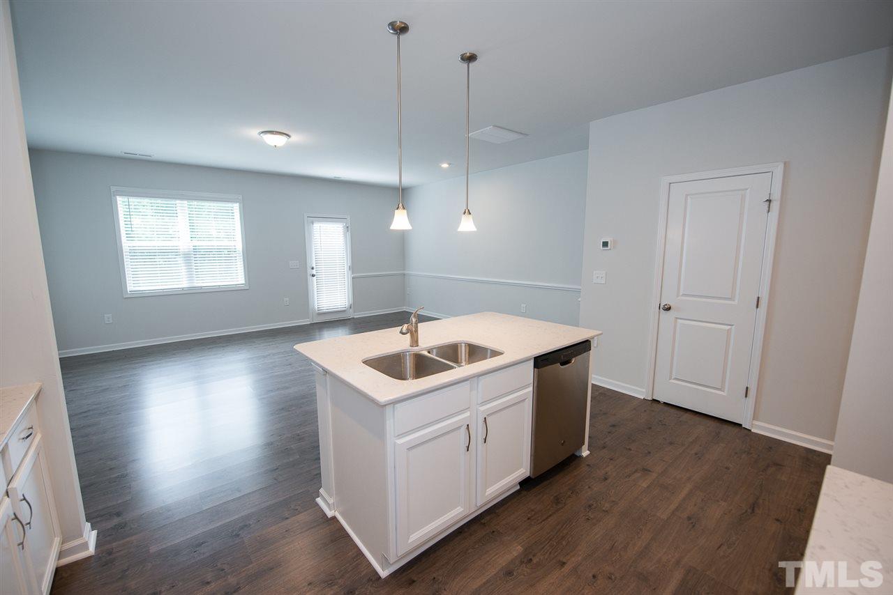 3610 Water Mist Lane, Unit 30 Raleigh, NC 27604 - Photo 7 of 25 a kitchen with a sink stove and wooden floor
