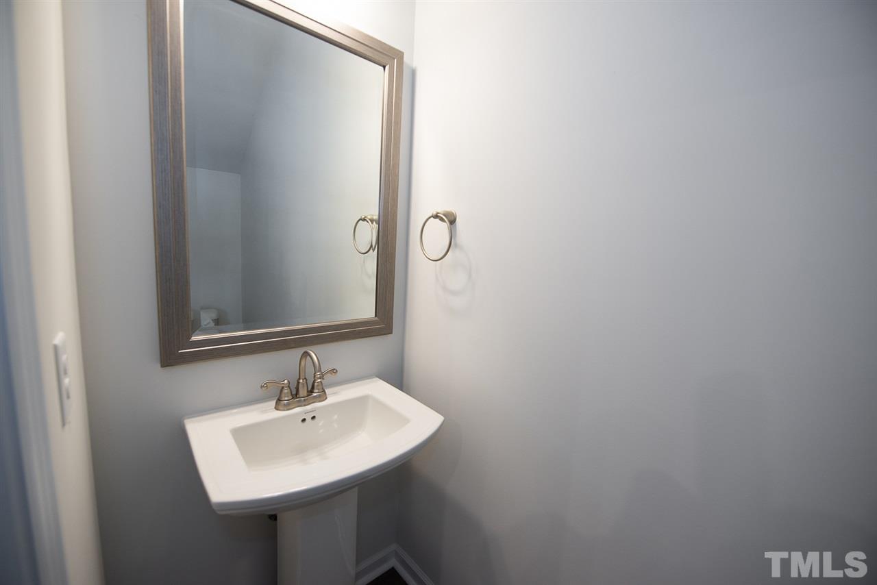 3610 Water Mist Lane, Unit 30 Raleigh, NC 27604 - Photo 9 of 25 a bathroom with a sink and a mirror