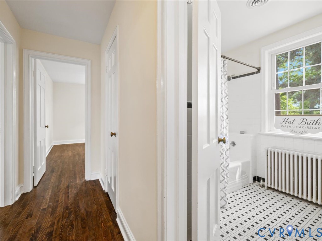 4803 Morrison Road Richmond, VA 23230 - Photo 29 of 45 a view of a hallway with wooden floor and a bathroom