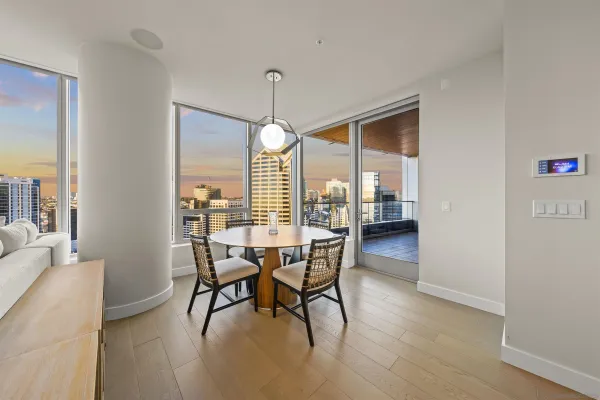a dining room with furniture and window