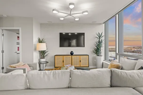 a living room with furniture and a flat screen tv