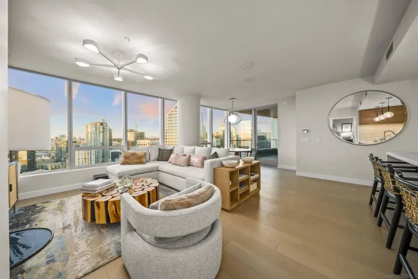 a living room with furniture and a large window