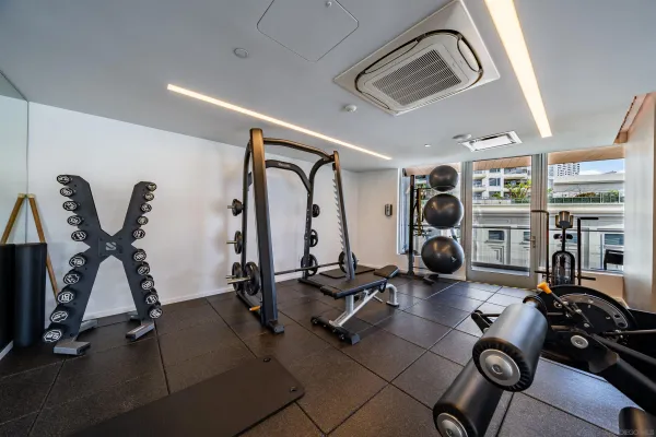 a view of a patio with a table chairs and a yard