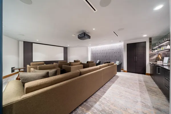 a living room with furniture and a chandelier