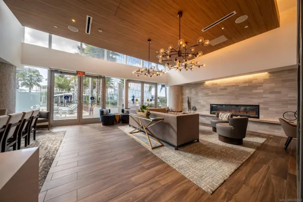 a view of a room with furniture and wooden floor
