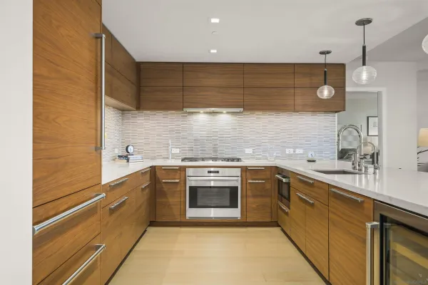 a kitchen with a sink cabinets and stainless steel appliances