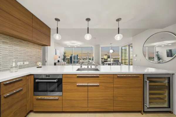 a kitchen with a sink cabinets and appliances
