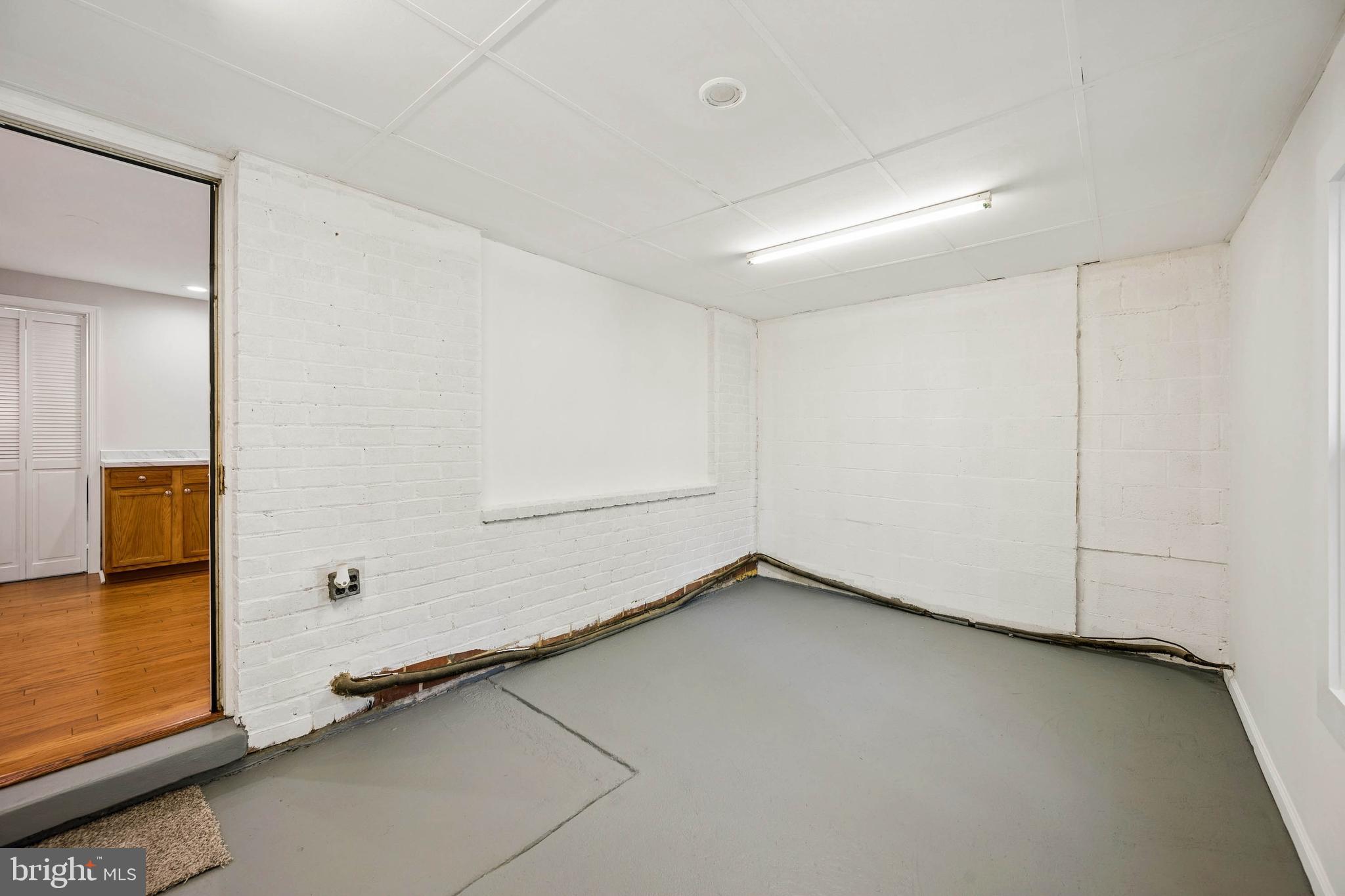 7227 Sindall Road Baltimore, MD 21234 - Photo 27 of 62 an empty room with windows
