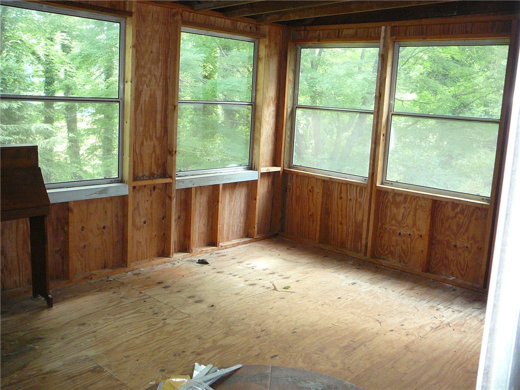 117 C-14-70 Anderson, SC 29621 - Photo 7 of 7 A rustic, unfinished room with panoramic views of the surrounding trees.
